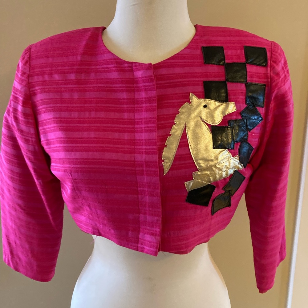 Vintage one of a kind, hand made silk cropped jacket with leather appliqués.